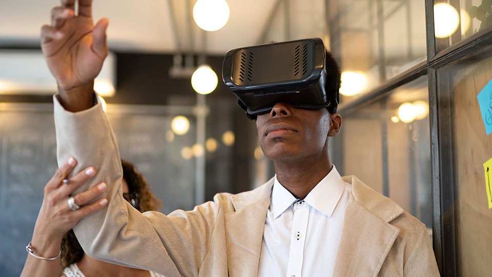 A man is assisted with a virtual reality headset